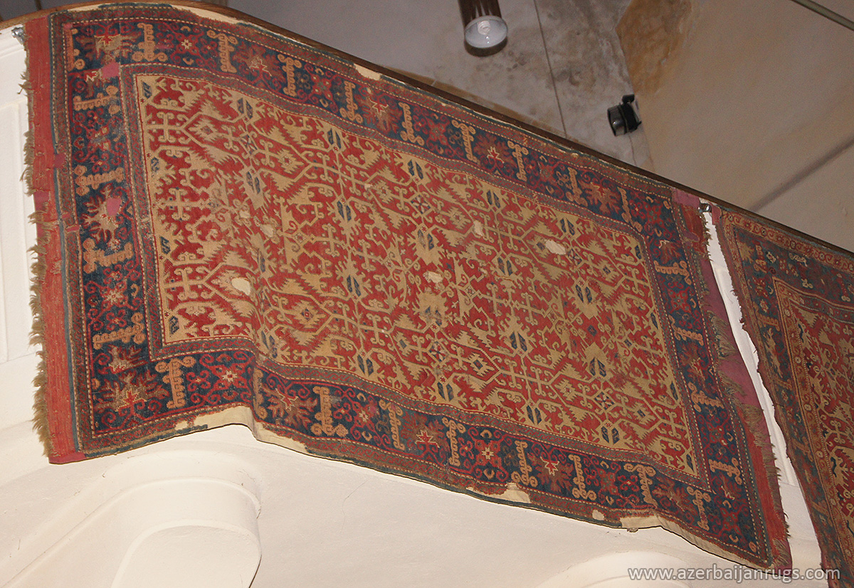 "Lotto" rug with ragged palmette and hooked bar motif border, kilim